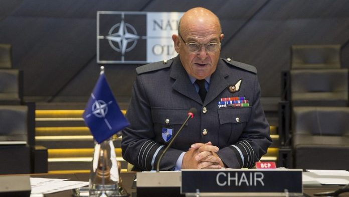 1280px-Stuart_Peach_NATO_chair-780x439